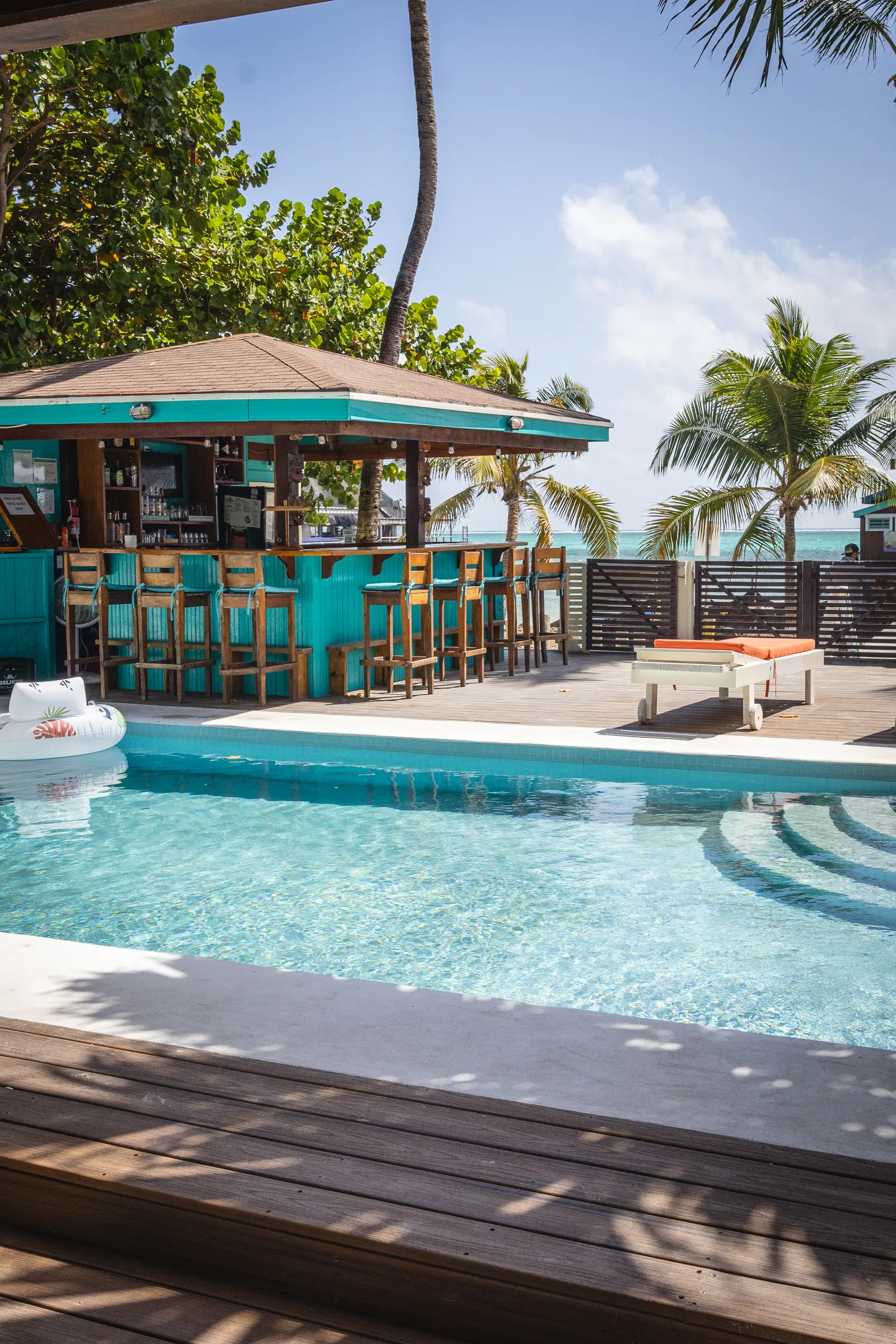 Poolside bar and pool deck at Ocean Tide Beach Resort