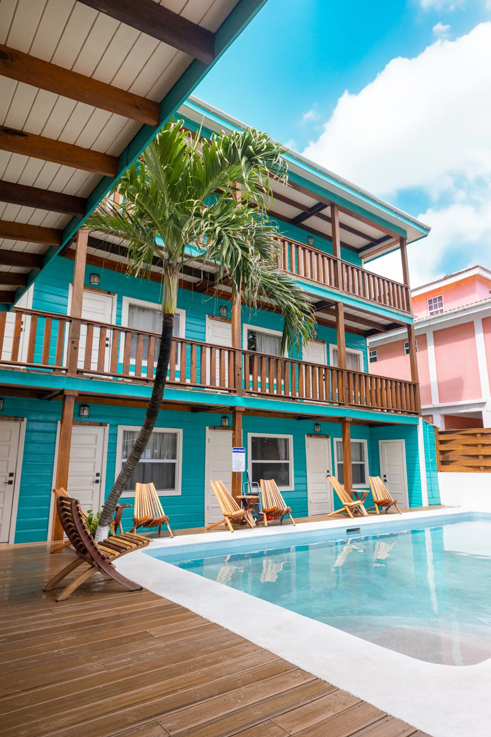 The three floors of Ocean Tide Beach Resort from the pool deck, San Pedro Belize: Reef View rooms on the top level
